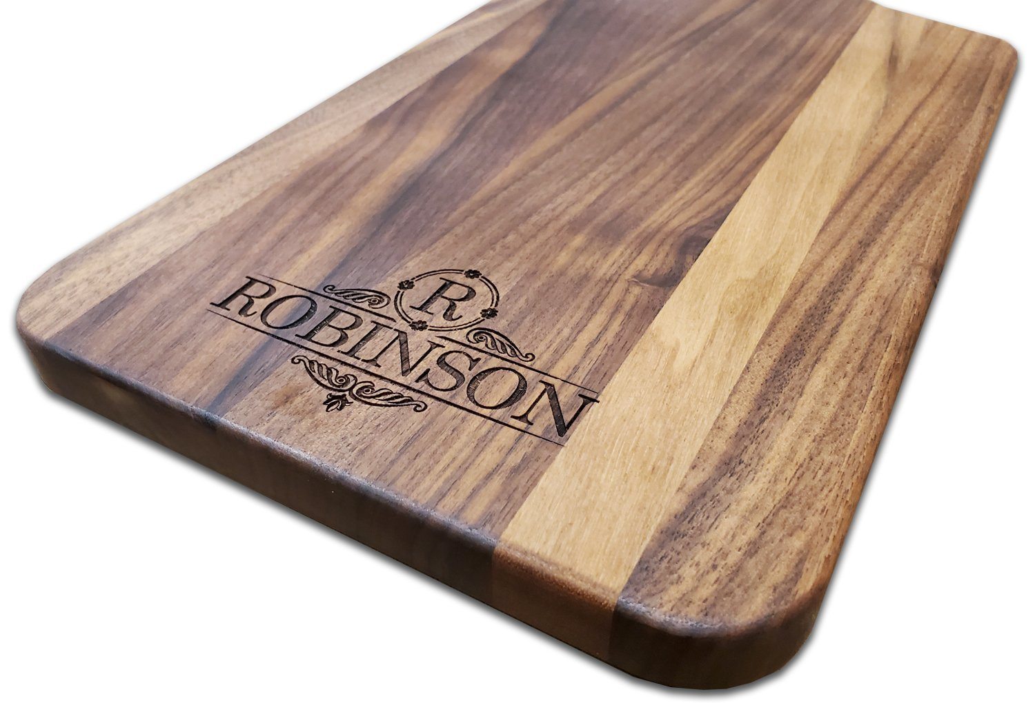 https://www.haileyhome.com/cdn/shop/products/personalized-walnut-cutting-board-with-4-inch-handle-8-x-17-bulk-discounts-517859_1024x1024@2x.jpg?v=1628786887