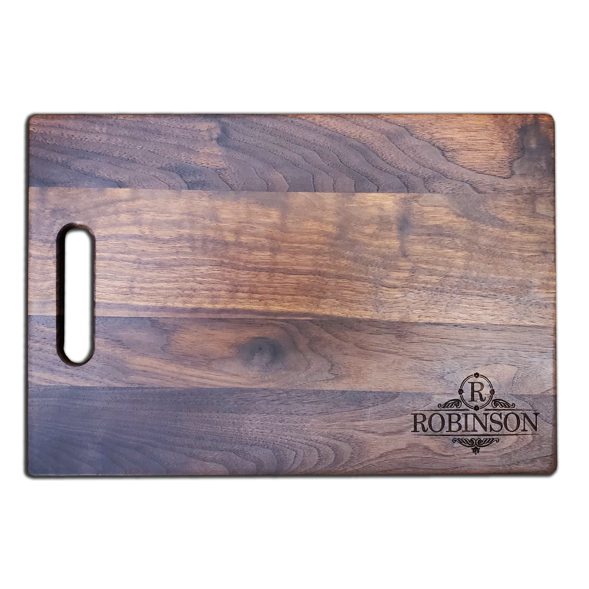 https://www.haileyhome.com/cdn/shop/products/personalized-walnut-cutting-board-with-handle-11-x-16-177957_1024x1024@2x.jpg?v=1628785299